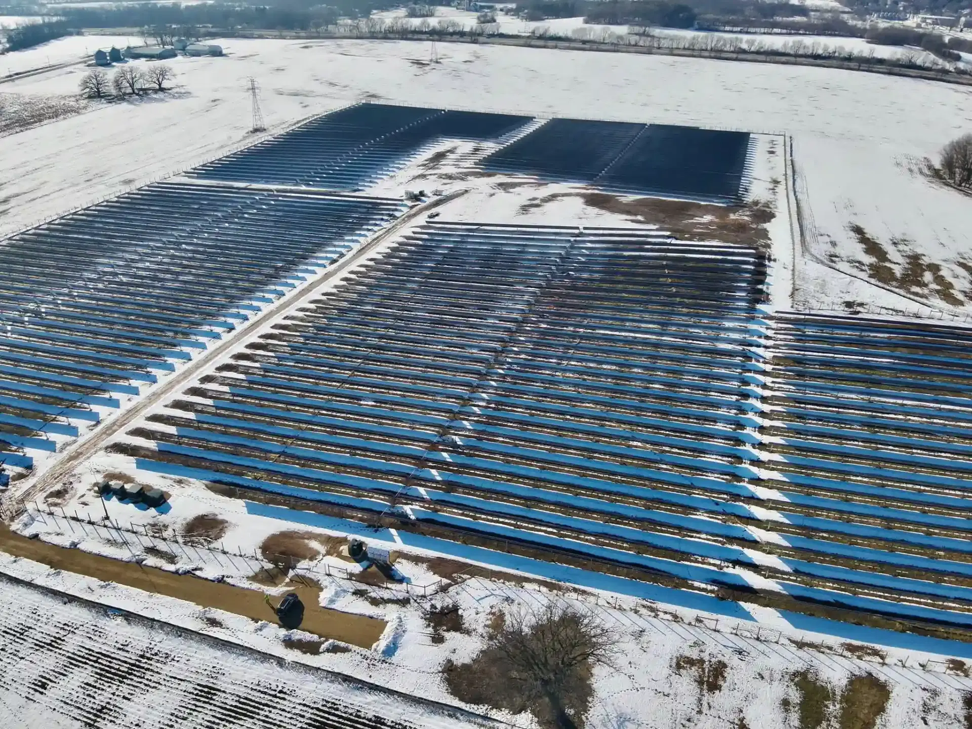 Aerial view of solar panels and industrial site