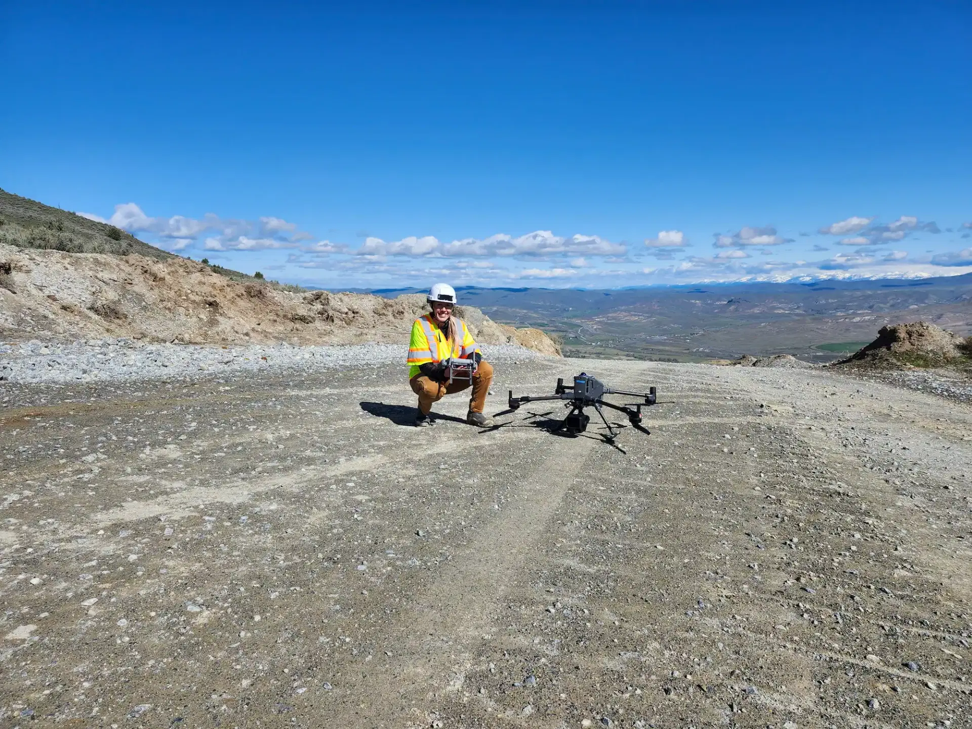 Angel Robinson on a quarry site with a survey drone in Oregon